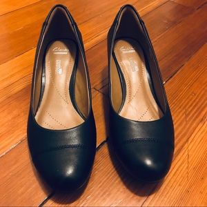 Clark’s black leather wedges